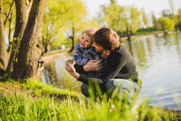 Free Photo father and son laughing in the park