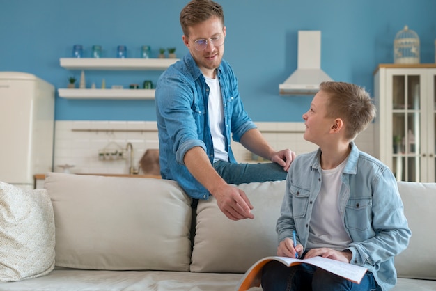 Father and son learning indoors