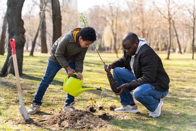 Father and son planting together