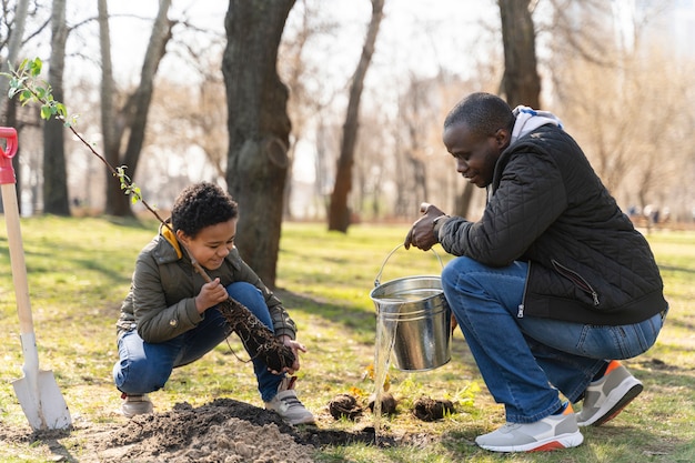 Father and son planting together