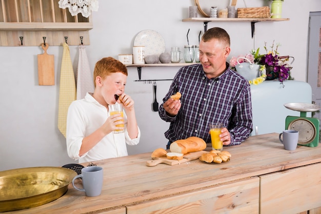 Father and son playing in the kitchen