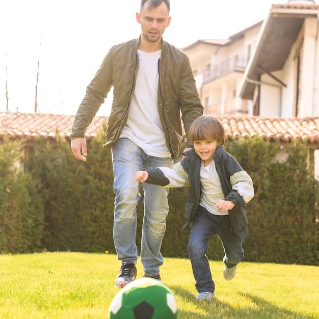 Free photo father and son playing outdoors