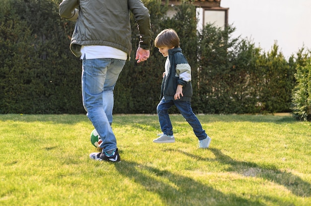 Free photo father and son playing outside