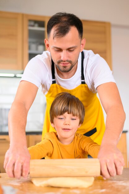 Father and son using the paddle front view