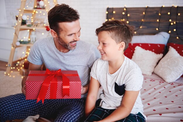 Father and son with christmas present