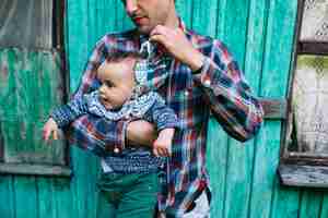 Free photo father taking off cap from child head