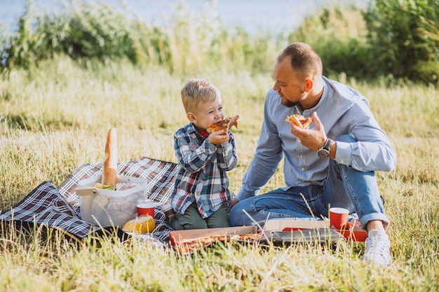 Father with his son having picnic in the park