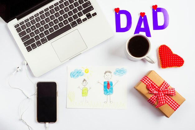 Fathers day composition with laptop and drawing