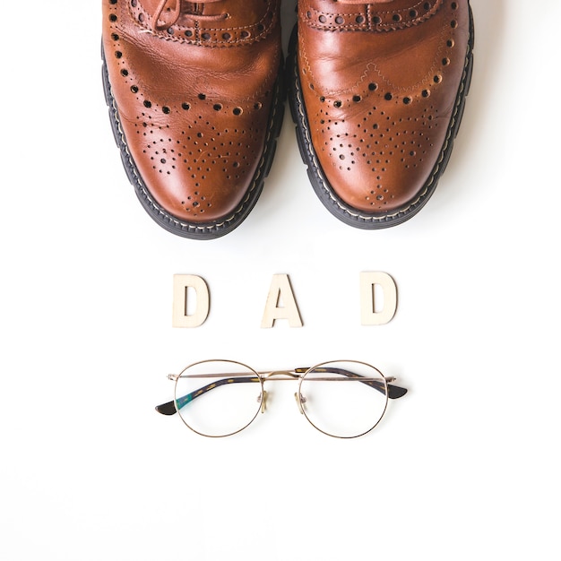 Fathers day composition with shoes and glasses