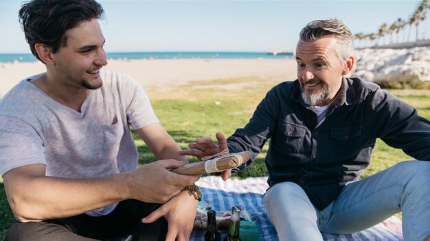 Fathers day concept with son giving present to father