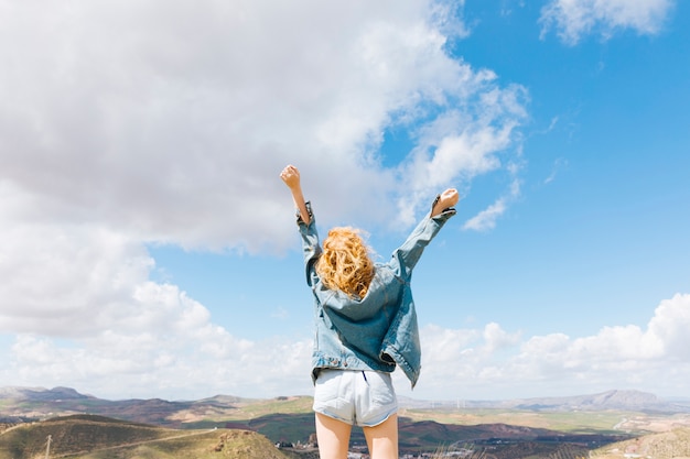 Free photo feeling free woman on hilltop