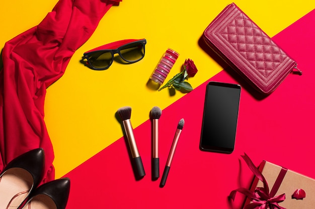 female accessories, makeup, sunglasses and smartphone, top view