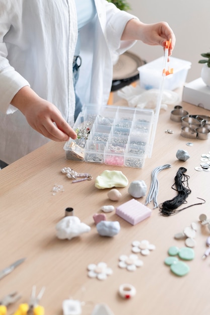 Female artisan working in the atelier with clay