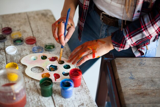 Female artist painting indoors