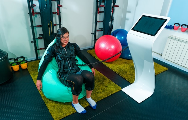 Female athlete doing exercises in a fitness studio