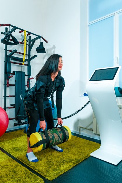 The female athlete doing they exercise in a ems fitness studio