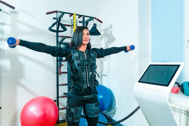 The female athlete doing they exercise in a ems fitness studio