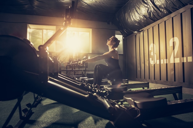 Free photo the female athlete training hard in the gym.