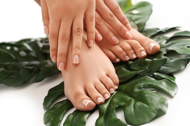 Female bare feet and hands. Manicure and pedicure concept