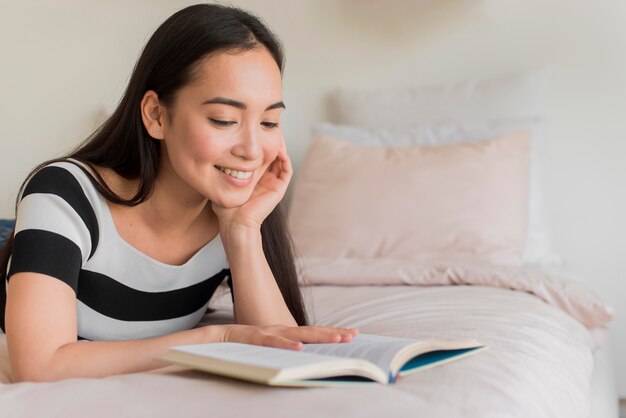 Female in bed reading