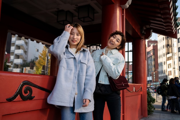 Female best friends hanging out together in town