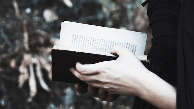 Free Photo female in black with opened book