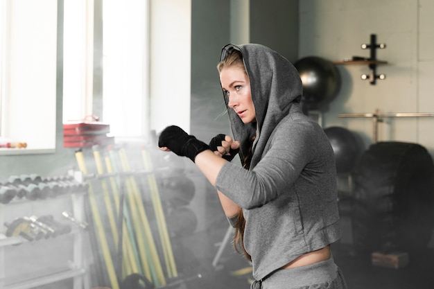 Free Photo female boxer training for a new competition with copy space