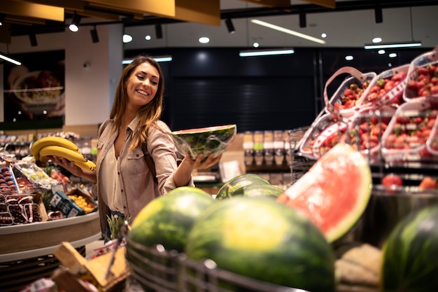 Female buying food at supermarket 