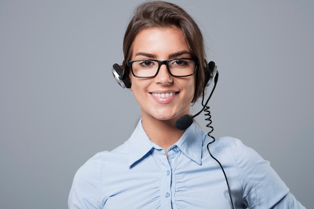 Free Photo female call center agent posing with headphones with mic