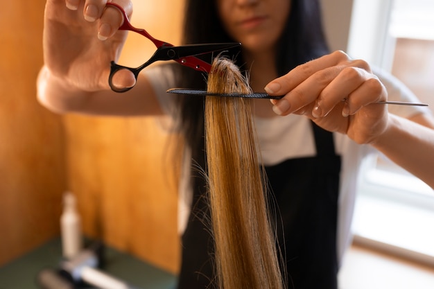 Female client getting her hair cut at the hairdresser