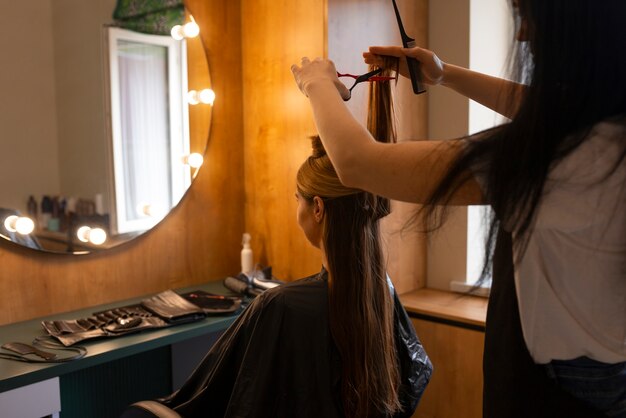 Female client getting her hair cut at the hairdresser