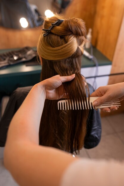 Female client getting her hair done at the hairdresser