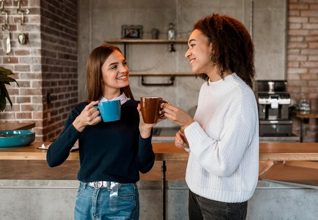 Female colleagues having coffee during a meeting