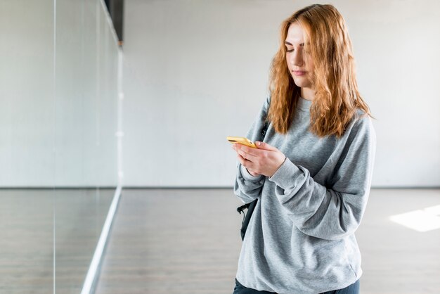 Female dancer using mobile phone