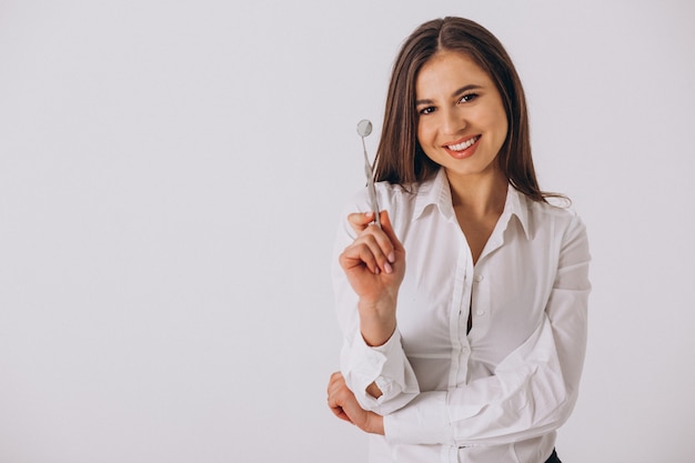 Female dentist with dentistry tools isolated