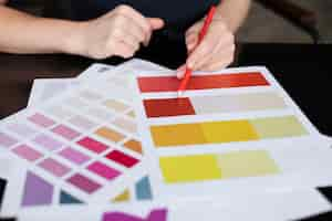 Free photo female designer checking brand colors for a logo