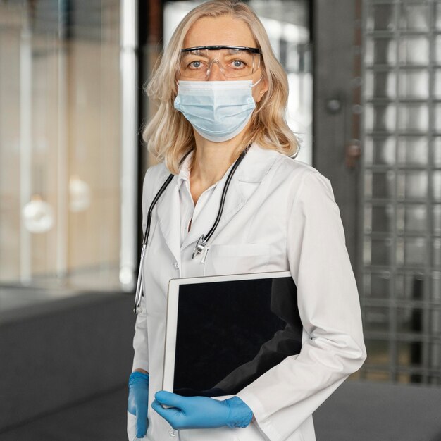 Female doctor portrait with medical mask