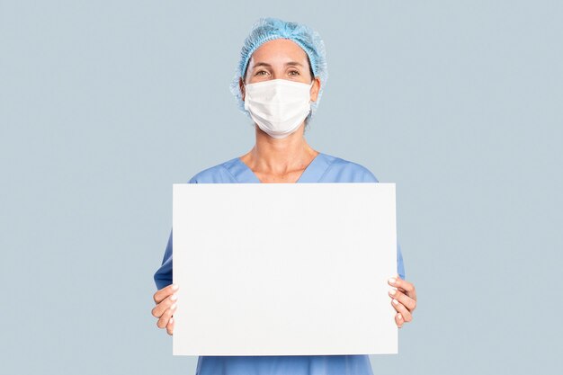 Female doctor showing a blank sign board