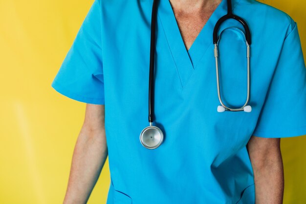 Female doctor with a stethoscope and a medical uniform