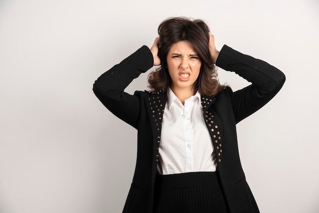 Free photo female employee holding her head because of troubles