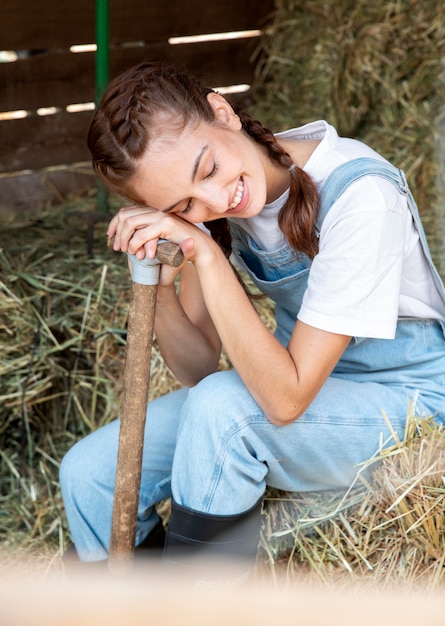 Free photo female farmer relaxing outdoors