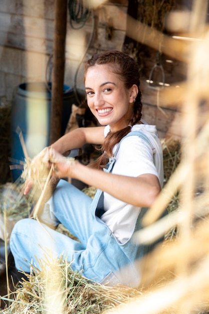 Free Photo female farmer relaxing outdoors