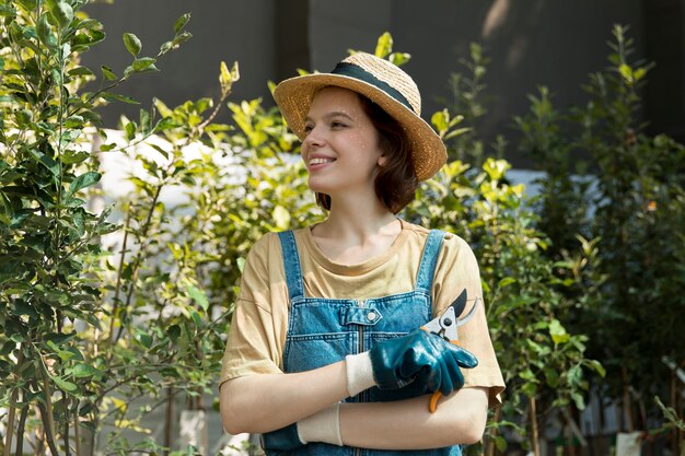 Female farmer working alone in her greenhouse