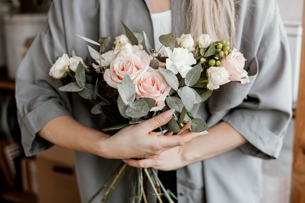 Female florist making a beautiful floral arrangement