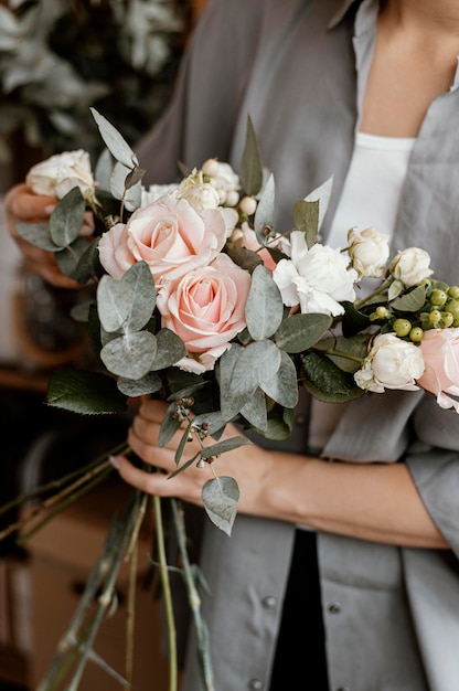 Female florist making a beautiful floral arrangement