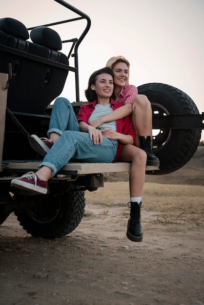 Free photo female friends traveling together by car