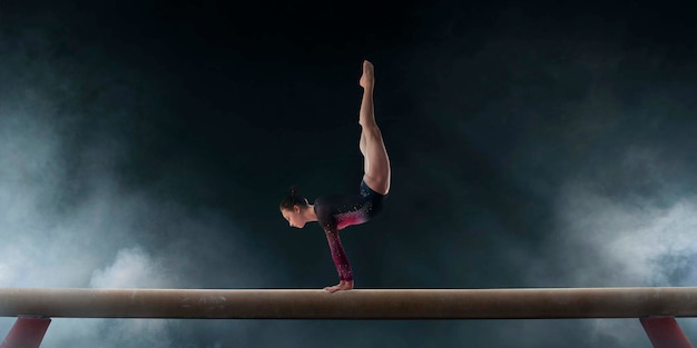 Female gymnast doing a complicated trick on gymnastics balance beam in a professional arena