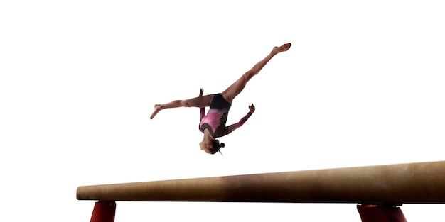 Female gymnast doing a complicated trick on white background