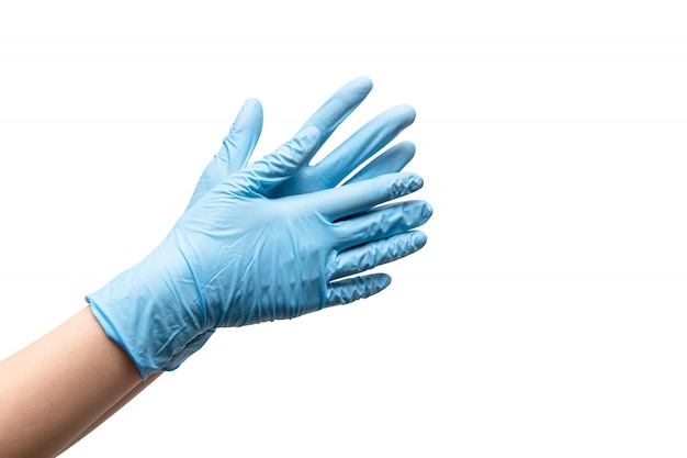 Free Photo female hands in disposable gloves on white background.