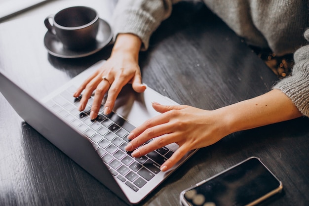 Female hands typing on computer keyboard